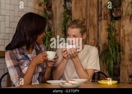 Two customers drinking coffee Stock Photo