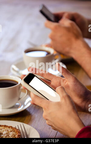 Couple using smartphones Stock Photo