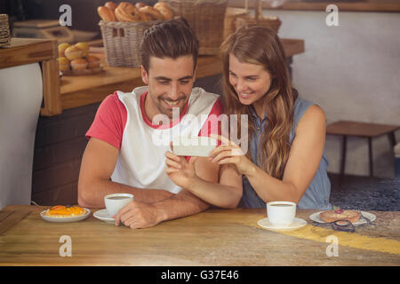 Couple using a smartphone Stock Photo