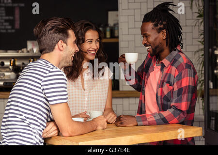 Friends talking together and smiling Stock Photo