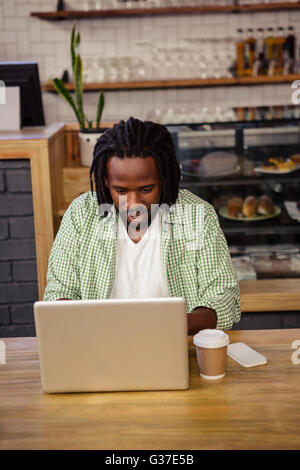 Young man using a laptop Stock Photo