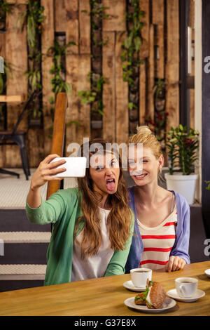 Smiling friends taking a selfie Stock Photo