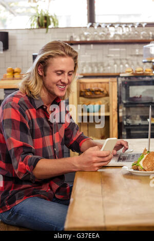 Man using smartphone and laptop Stock Photo