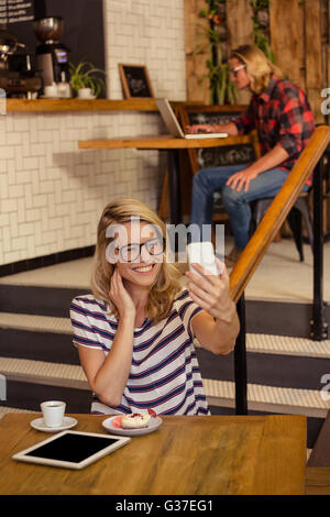 Woman taking a selfie Stock Photo