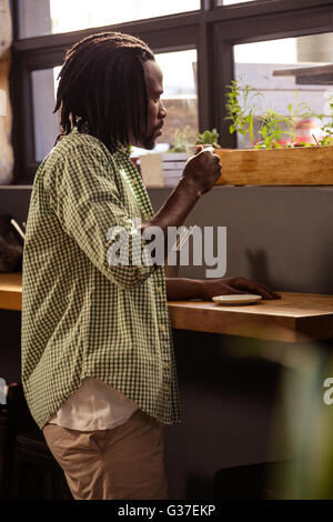 Man drinking a cup of coffee Stock Photo