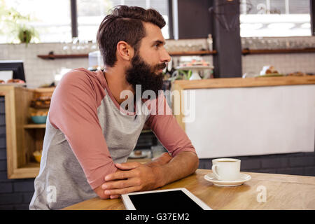Man sitting at a table Stock Photo