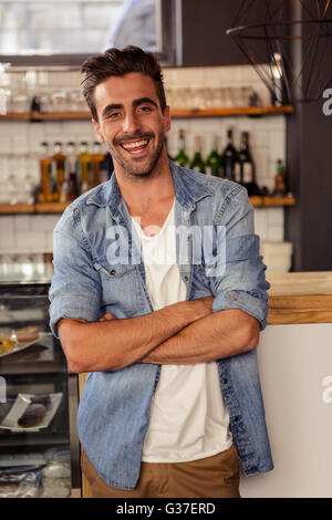 Man standing with arms crossed Stock Photo