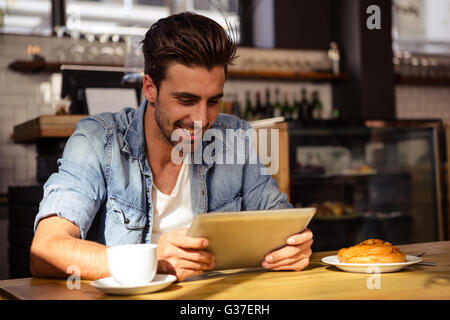 Smiling man using tablet Stock Photo