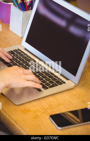 Close up view of businessman using laptop computer Stock Photo