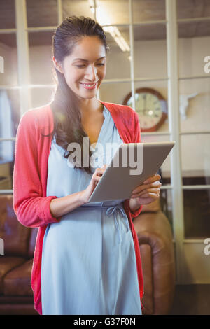Businesswoman posing with her tablet Stock Photo