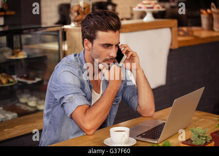 Side view of hipster man working Stock Photo
