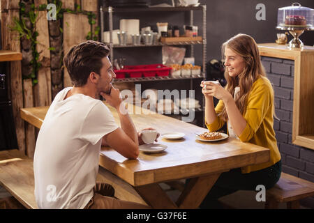 Two smiling hipsters drinking coffee Stock Photo