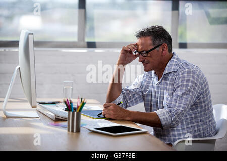 Businessman taking notes on a book Stock Photo