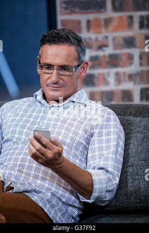 Close up of businessman looking his mobile phone Stock Photo