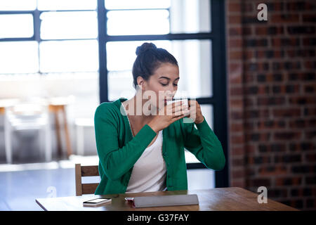 Businesswoman drinking a coffee Stock Photo