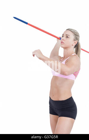 Female athlete throwing a javelin Stock Photo