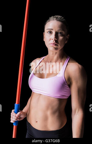 Female athlete holding a javelin Stock Photo