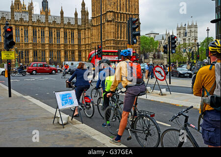 Commuters cycling to work on an urban street Stock Photo