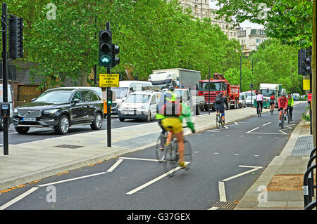 Commuters cycling to work on an urban street Stock Photo