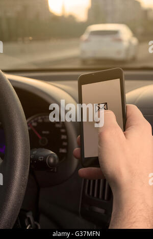 Checking e-mail while driving Stock Photo