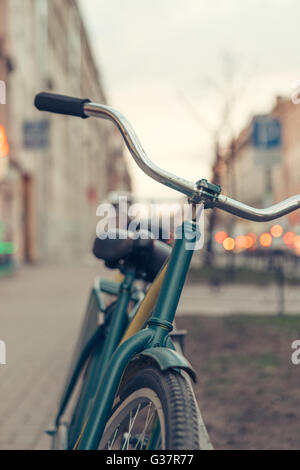 the bike stands on city street Stock Photo