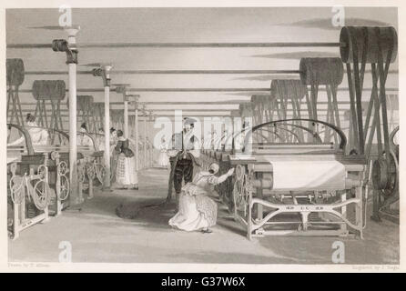 Interior of cotton mill: power loom weaving. Man and woman tend machine.       Date: 1835 Stock Photo