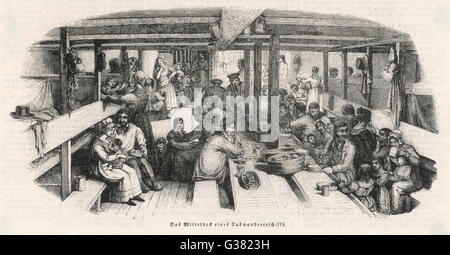 Emigrants on their way to Australia eat their dinner below decks. The Illustrated London News states that 'a government grant was made to assist families and single men, agricultural labourers, shepherds, carpenters, smiths, wheelwrights, bricklayers and Stock Photo
