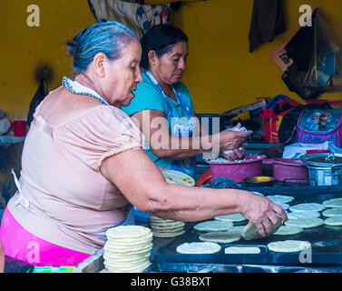 Salvadoran women prepares Popusas in Suchitoto El Salvador Stock Photo