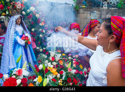 Salvadorian women participate in the procession of the Flower & Palm Festival in Panchimalco, El Salvador Stock Photo