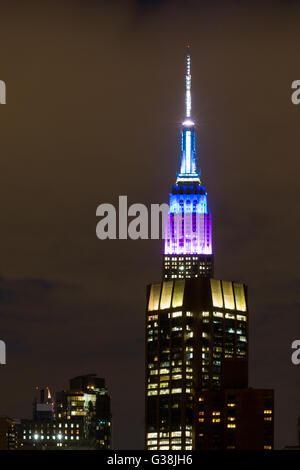 New York, USA. 8th June, 2016. The Empire State Building is lit up in white, blue and purple in honor of World Oceans Day, a UN-designated day held annually on June 8, in New York, the United States, June 8, 2016. Credit:  Li Muzi/Xinhua/Alamy Live News Stock Photo