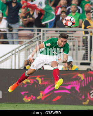 Pasadena, USA. 9th June, 2016. Mexico's Hector Herrera vies for the ball during the Copa America Centenario tournament Group C football match between Mexico and Jamaica in Pasadena, California, the United States, on June 9, 2016. Credit:  Yang Lei/Xinhua/Alamy Live News Stock Photo