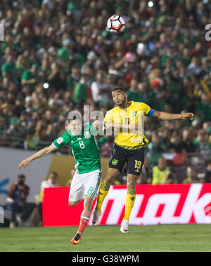 Pasadena, USA. 9th June, 2016. Mexico's Hirving Lozano (L) vies with Jamaica's Giles Barnes during the Copa America Centenario tournament Group C football match in Pasadena, California, the United States, on June 9, 2016. Credit:  Yang Lei/Xinhua/Alamy Live News Stock Photo