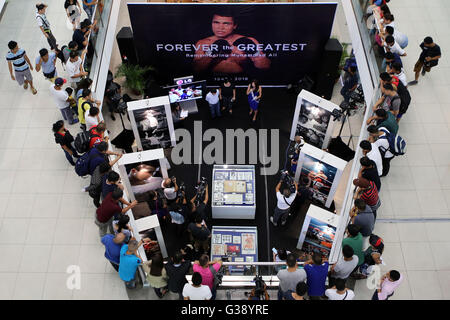 Quezon City, Arizona, USA. 3rd June, 2016. People attend the opening of an exhibit commemorating Muhammad Ali inside a mall in Quezon City, the Philippines, June 10, 2016. The exhibit showcased vintage photos, posters, and other memorabilia from the 1975, when Muhammad Ali versus Joe Frazier boxing fight dubbed 'Thrilla in Manila', to pay tribute to Ali who died in Phoenix, Arizona, at the age of 74 on June 3, 2016. © Rouelle Umali/Xinhua/Alamy Live News Stock Photo