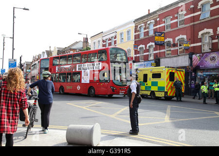 Harringay, North London 10 June 2016 Over 40 firefights, 8 fire engines attend a second floor flat over a cafebar in Green Lanes at the junction of St Anns Road, Harringay, North London. Credit:  Dinendra Haria/Alamy Live News Stock Photo