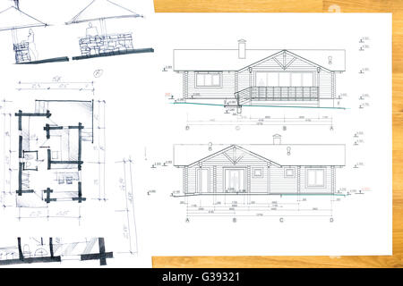 designer's hand drawing with house plan blueprints Stock Photo