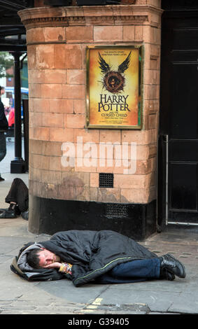 Harry Potter and the Cursed Child Palace Theatre Now showing Harry Potter and the Cursed Child.  Homeless man sleeps i Stock Photo