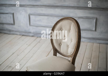 Back of vintage classical style Chair in white room Stock Photo