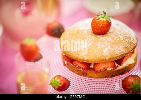 Strawberry cake and chocolate dipped strawberries for afternoon tea Stock Photo