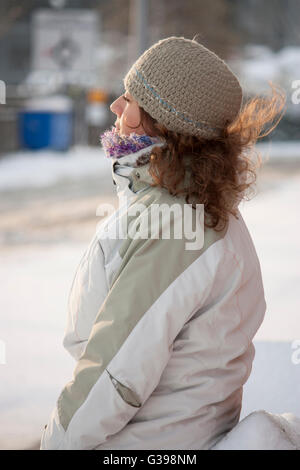 A woman enjoying the snow Stock Photo