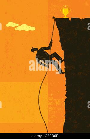 Climbing to Victory A businessman climbing a rope up the side of a cliff about to reach the top. Stock Vector
