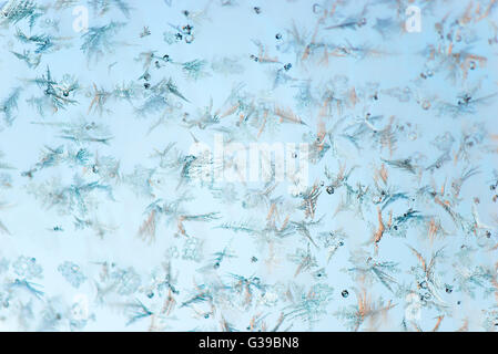 Beautiful winter frost patterns painted on glass Stock Photo