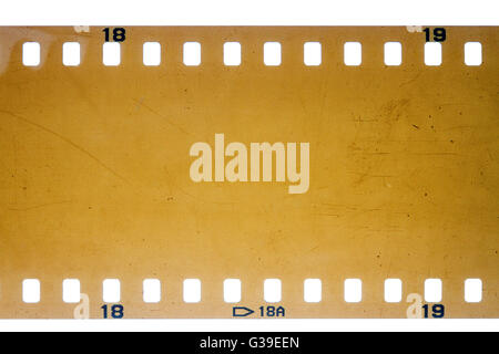 Blank yellow vibrant noisy filmstrip isolated on white background Stock Photo