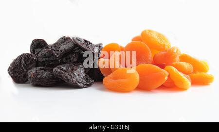 Dried prunes and apricots fruits isolated on white background Stock Photo