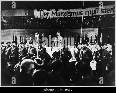 HITLER Speakingin the Berlin  Sportpalast at the start of  his election campaign.  The  banner behind reads, &quot;Marxism must be exterminated&quot;     Date: 10 February 1933 Stock Photo
