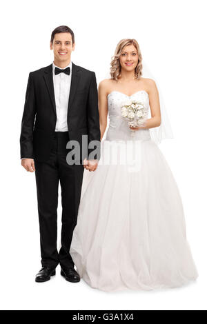 Full length portrait of a young newlywed couple posing isolated on white background Stock Photo