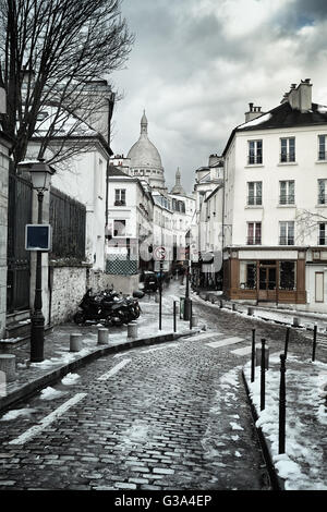 Little street and Sacre Coeur in Montmartre, Paris, France Stock Photo