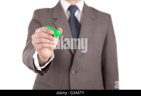 Businessman writing with green marker isolated on white with clipping path Stock Photo
