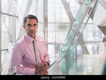 Portrait serious corporate businessman in modern office lobby Stock Photo