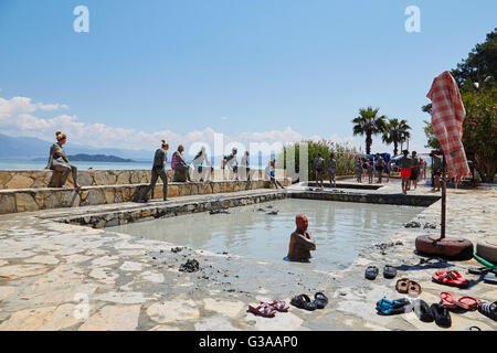 People taking a mud bath, thermal spa on Lake Koycegiz, Sultaniye, near Dalyan, Mugla Province, Turkey. Stock Photo