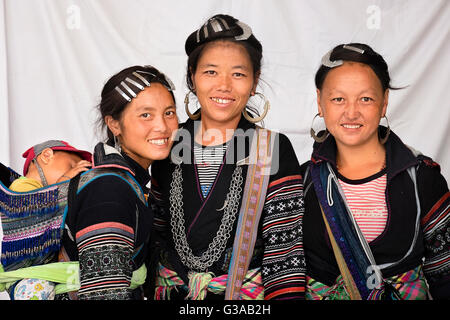 Hmong women and a baby are wearing traditional costumes in Sapa, Lao Cai Province, Vietnam Stock Photo